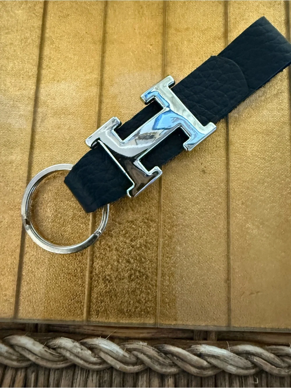 “H” chrome and black leather keychain